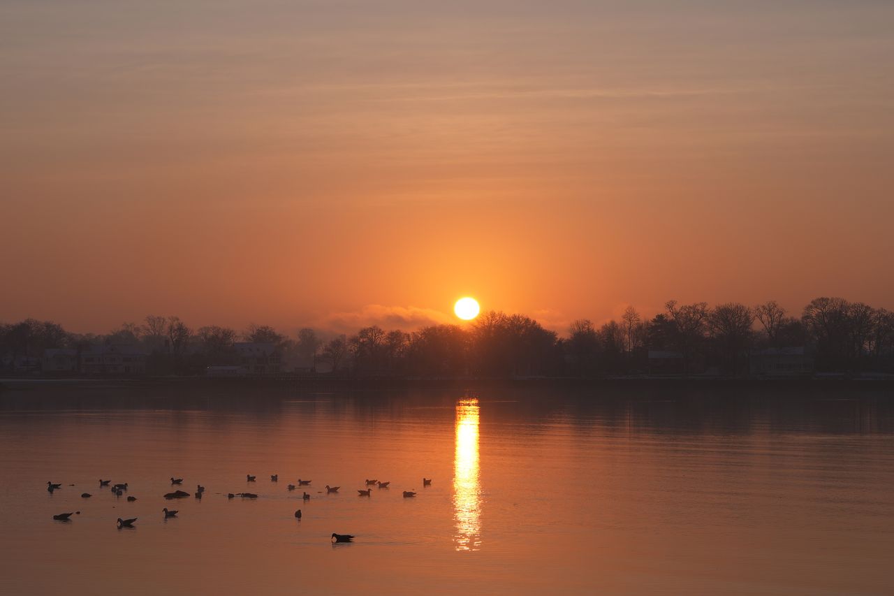 About Beautiful winter sunrise over Cove Island Park in Stamford, Connecticut with reflections on the water.